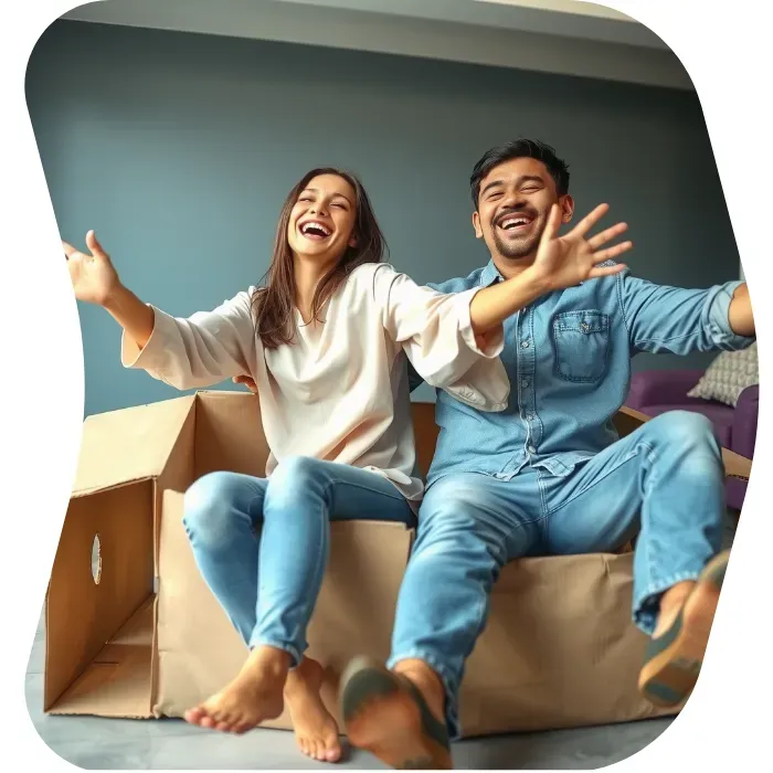 Two guys sitting on the floor of their apartment with Muval moving boxes